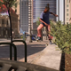A skateboarder performs a frontside noseslide on a concrete ledge in Skate 4.